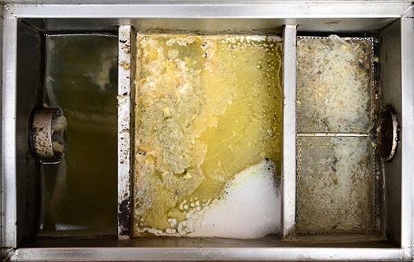 neglecting grease interceptor cleaning can lead to foul odors, backed-up plumbing, and costly repairs in the kitchen